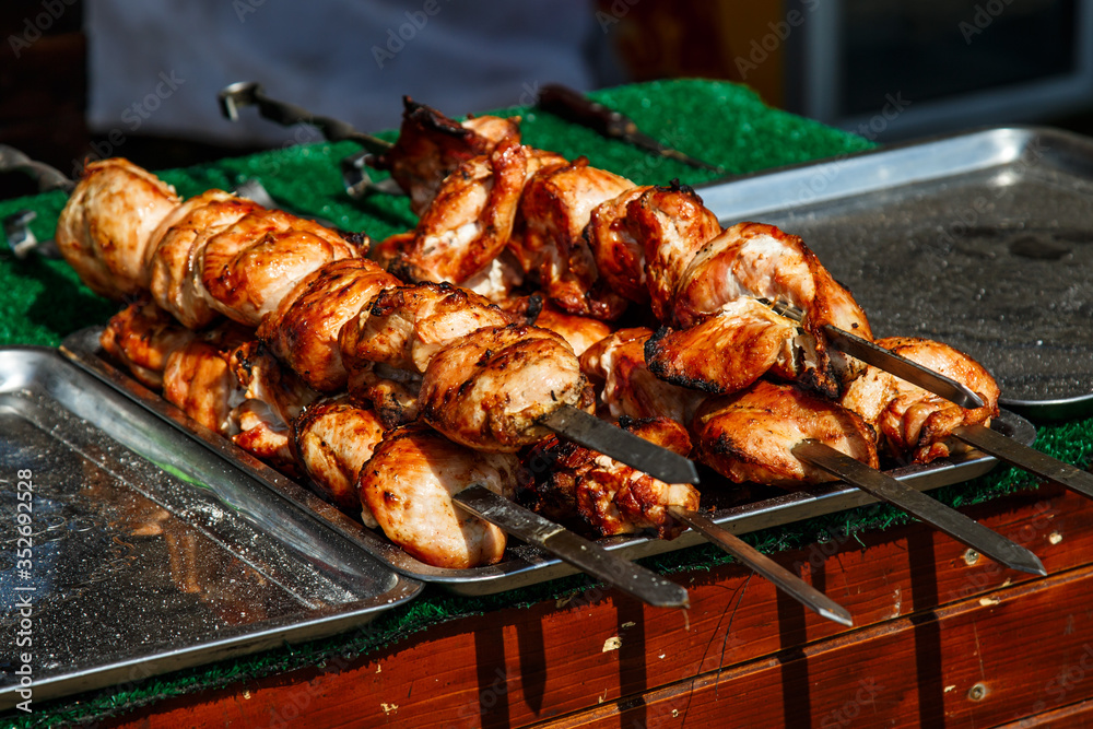 Slice pieces of meat on the grill. barbecue at the festival. Cheese and roasted veal on skewers.Cooking at the festival. Slice pieces of meat on the grill. barbecue at the festival. Cheese and roasted veal on skewers.Cooking at the festival.