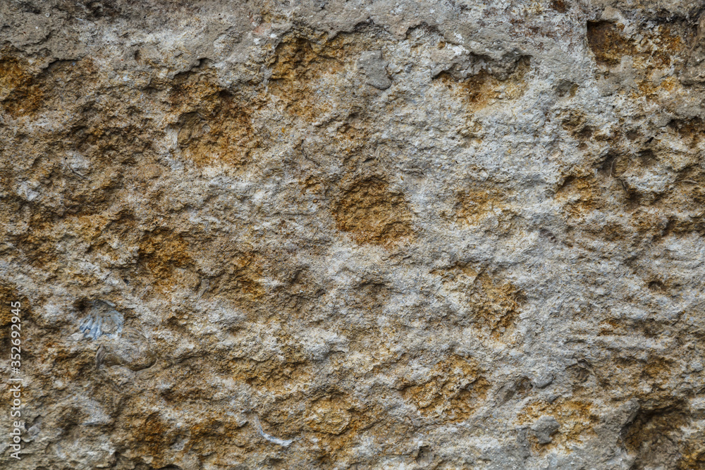 Cobblestone texture.Marble and granite drainage system closeup.Concrete wall with gravel. Gray foundation of the house. Cobblestone texture.Marble and granite drainage system closeup.Concrete wall with gravel. Gray foundation of the house.