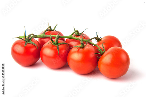 Branch of ripe cherry tomatoes isolated on white background