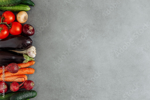 Local market fresh vegetable, garden produce on gray cement, clean eating and dieting concept. Flat lay with empty space. Food background. Top view