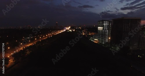 Victory Park 4K night aerial video with background view of Moscow City Business Center, Kutuzovskiy Avenue busy road traffic, memorial complex in Poklonnaya Hill, near Moscow River in Moscow, Russia