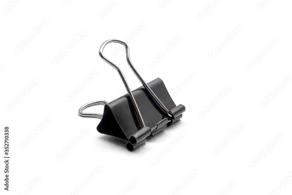 Black office paperclip holding sheets isolated on white background Black office paperclip holding sheets isolated on white background