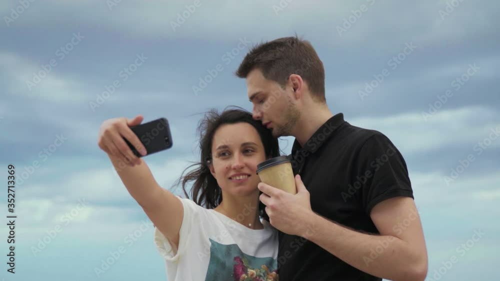 Romantic Happy Couple In Love Taking Photos On Phone on seaside. Romantic Happy Couple In Love Taking Photos On Phone on seaside.