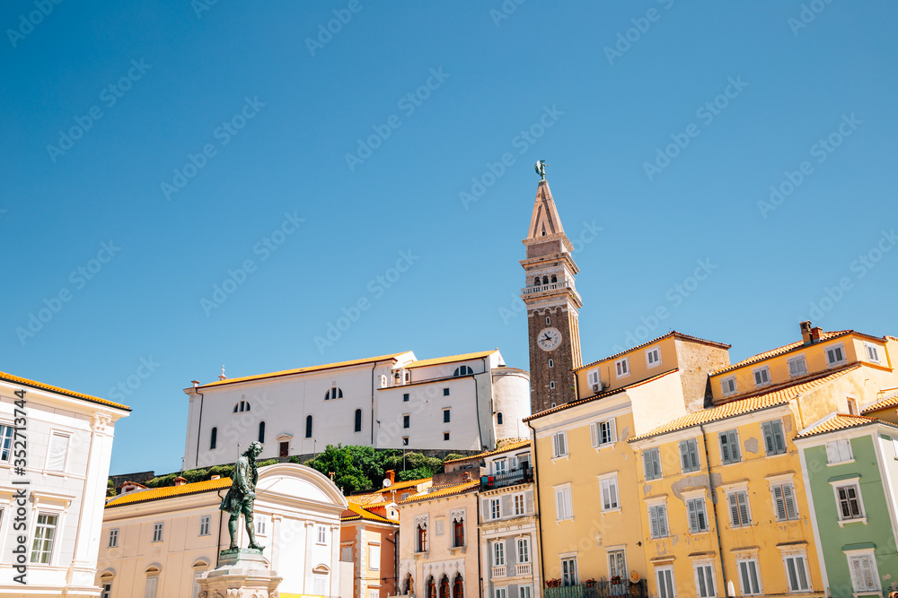 St. George's Parish Church and old town colorful buildings at Tartini square in Piran, Slovenia