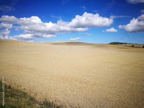 Scenic View Of Sand Dunes Against Sky