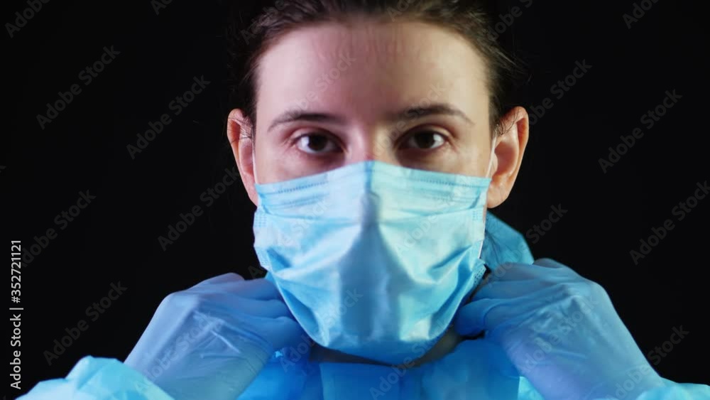 Portrait of a female medical worker. doctor dresses protective uniform, mask, goggles. a pandemic covid-19, outbreak. coronavirus protection Portrait of a female medical worker. doctor dresses protective uniform, mask, goggles. a pandemic covid-19, outbreak. coronavirus protection