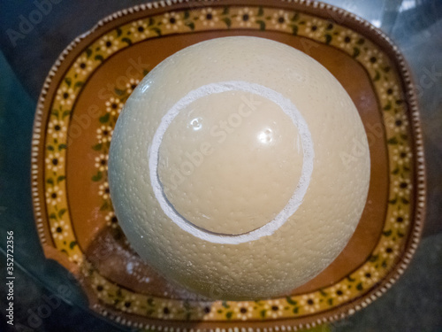 Ostrich egg opening.