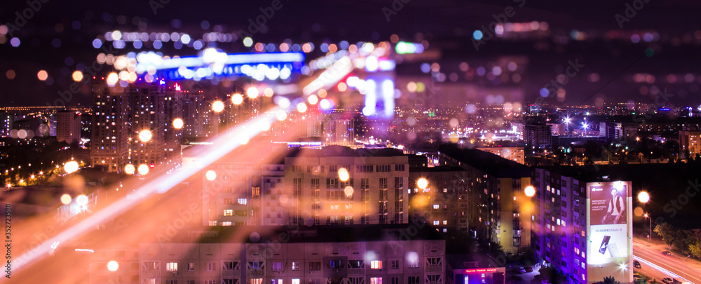 Illuminated City Against Sky At Night