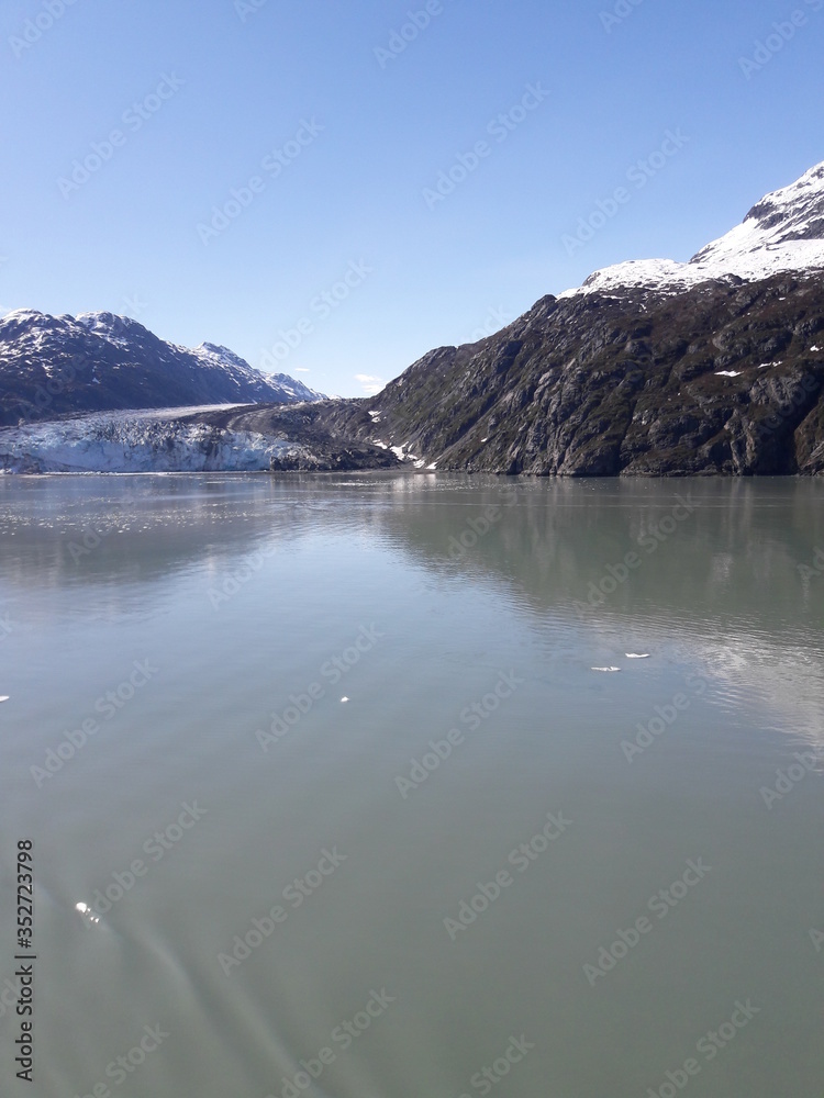 Alaska glacier, lake, canal, mountains and snow with a clear blue sky on a sunny spring day 2018