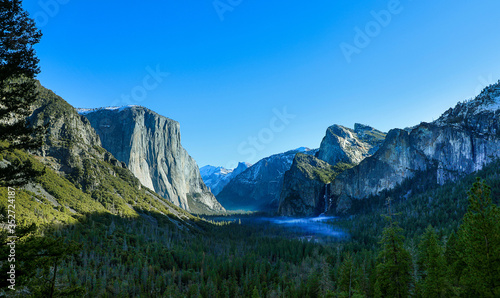 Panoramic view of the early morning sunlights and fog filling Yosemite Valley © Jason Busa