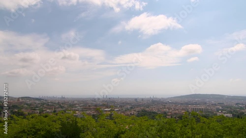 Aerial lockdown trees in city against sky on sunny day - Barcelona, Spain photo