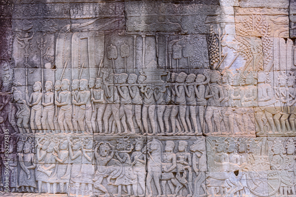 Stone carvings on the walls of the Bayon Temple in Angkor Thom