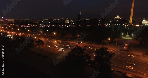 4K night aerial video of Kutuzovskiy Avenue highway at Victory Park and memorial complex in Poklonnaya Hill, near Moscow River in Moscow, Russia