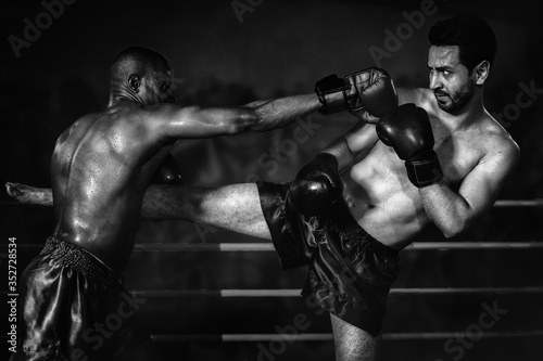 diverse boxing fighters fighting on ring in champion match © Mongkolchon