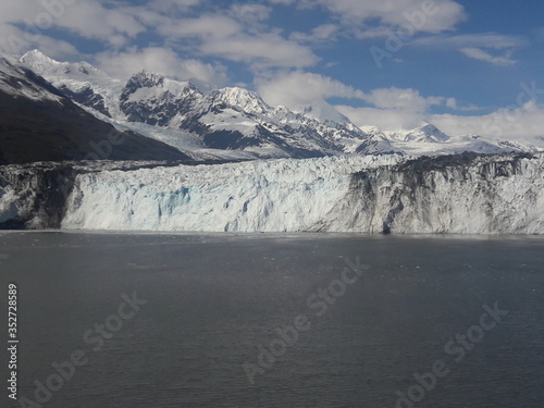 Alaska glacier, lake, mountains, snow and blue sky on a sunny day © CURTIS