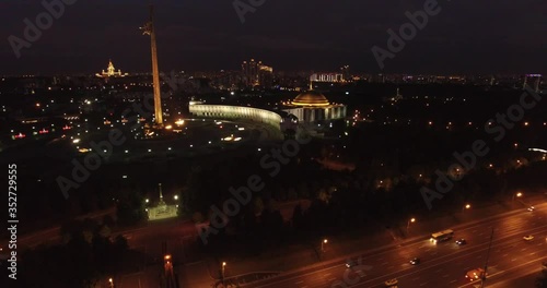 Victory Park 4K night aerial video with background view of Moscow City Business Center, Kutuzovskiy Avenue busy road traffic, memorial complex in Poklonnaya Hill, near Moscow River in Moscow, Russia