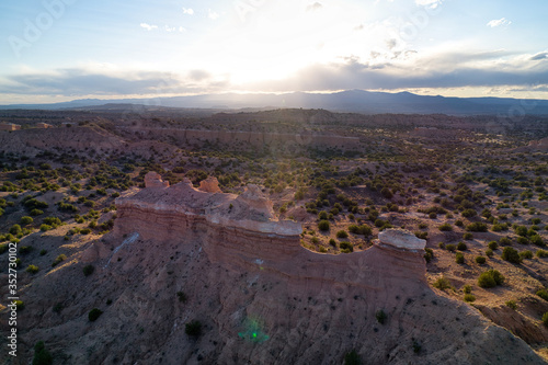 Sunset Aerial photograph of a New Mexico Landscape with Views of dramatic cliffs, mountains, and mesas photo