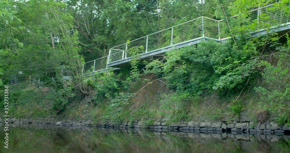 Worm view of walkway over looking riverbank Worm view of walkway over looking riverbank