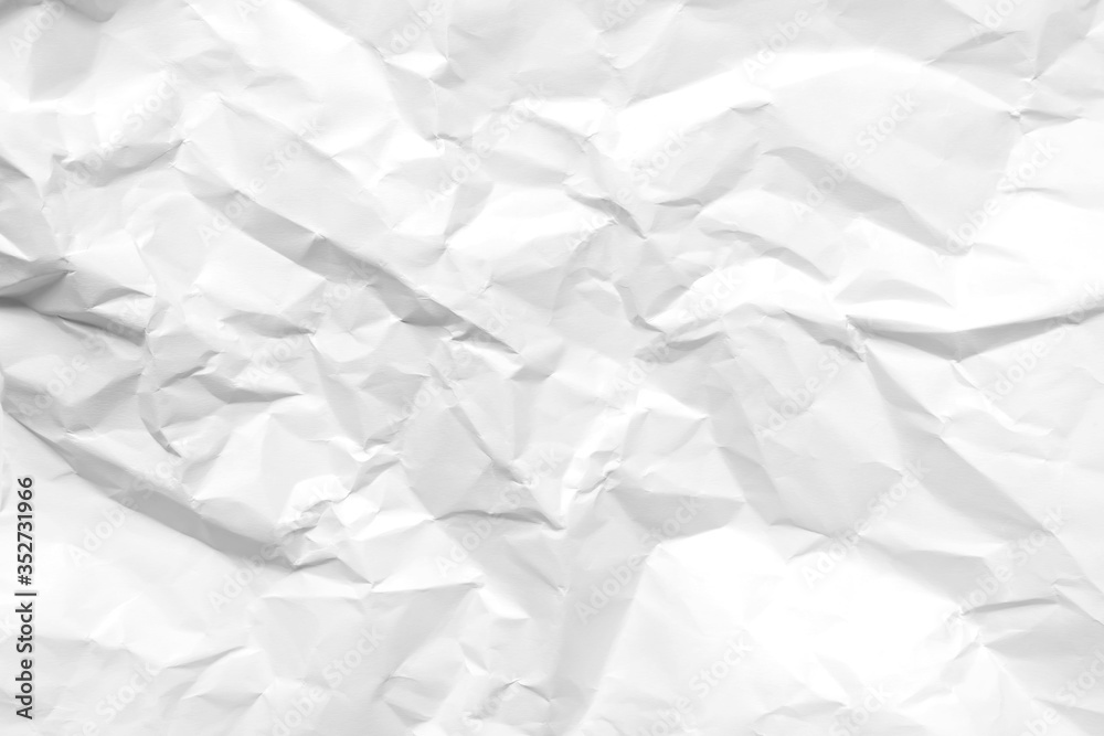 White crumpled paper texture background. Clean white paper. Top view. White crumpled paper texture background. Clean white paper. Top view.