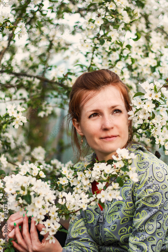 girl in blooming apple trees girl in blooming apple trees