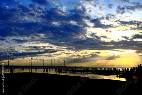 Gaomei wetlands during sunset with wind turbine background in Taiwan Taichung 