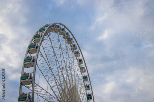 Ferris Wheel with blue sky on sunny day © pandaclub23