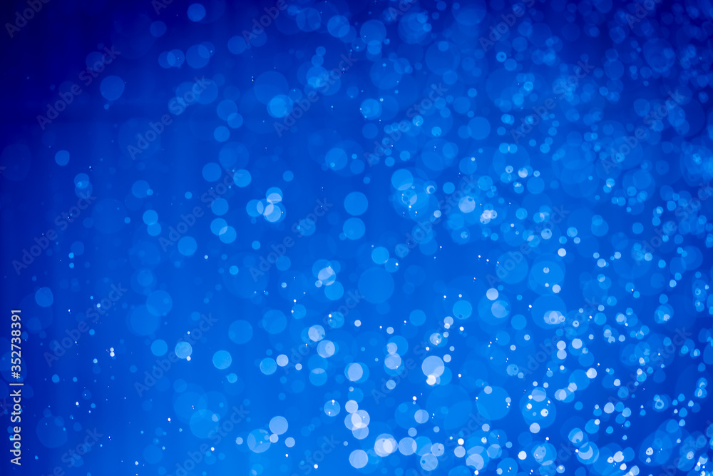 Abstract dark blue christmas glitter lights defocused bokeh Abstract dark blue christmas glitter lights defocused bokeh