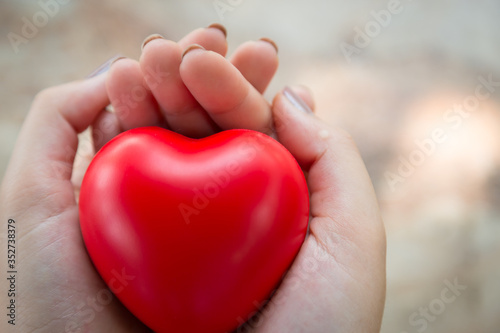 Woman hold red heart