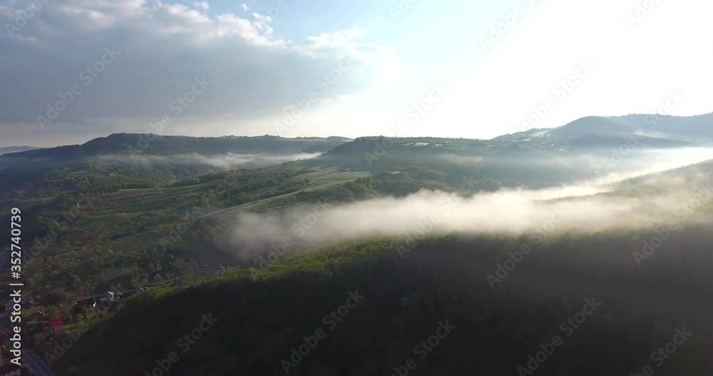 Mists rising in the sunrise light Mists rising in the sunrise light