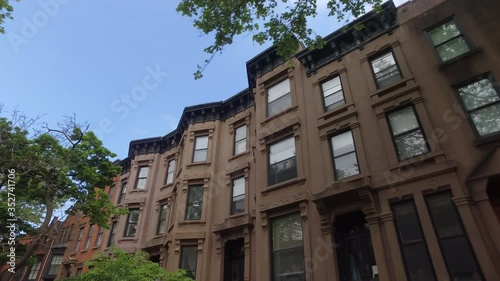 POV shot driving past brownstones on Strong Pl. in Cobble Hill Brooklyn photo