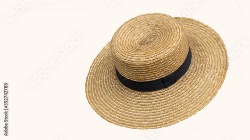 The brown straw hat that cuts the background off makes it a white background.
