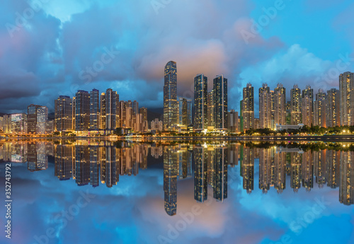 Panorama of skyline and Harbor of midtown of Hong Kong city at dusk © leeyiutung