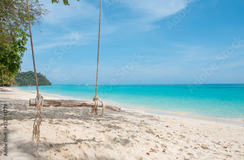 Wooden swing hang at Koh Phak Bia Island, Krabi, Thailand. Travel destination and nature environment concept , summer holiday background.