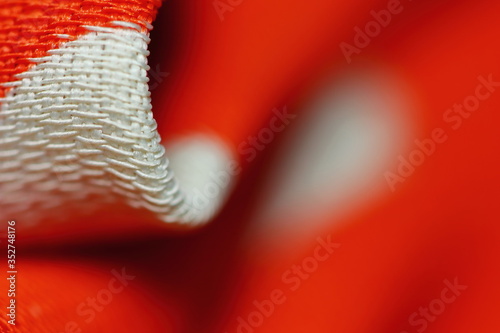 beautiful red color texture of cloth in abstract macro for background