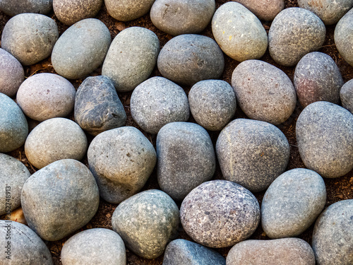 Mineral Background: Round pebbles close-up photo with different shapes and forms.
