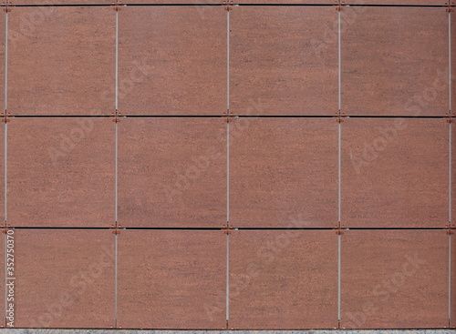 The wall is lined with brown tiles