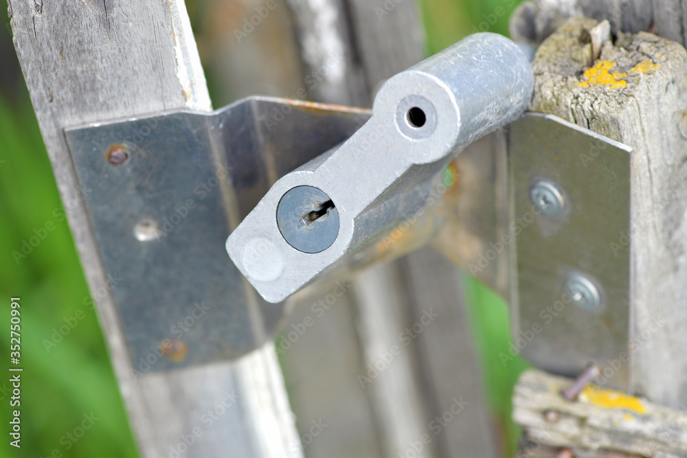 Old lock in a wooden gate, close-up: a key hole Old lock in a wooden gate, close-up: a key hole