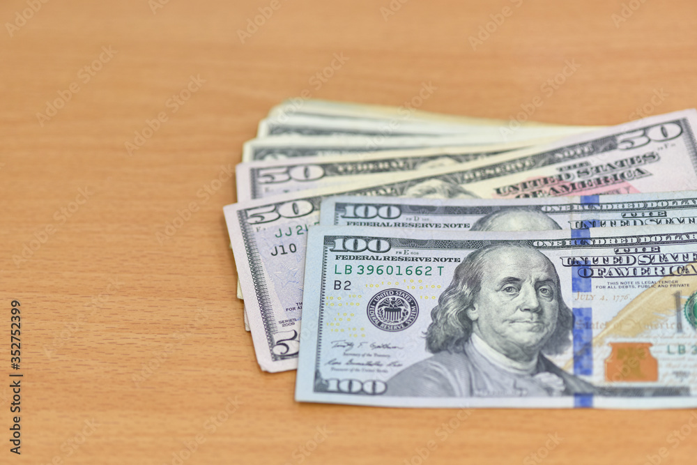Dollars bills, American Dollars Cash Money. One Hundred Dollar Banknotes. Exchange rate concept. Dollars bills, American Dollars Cash Money. One Hundred Dollar Banknotes. Exchange rate concept.