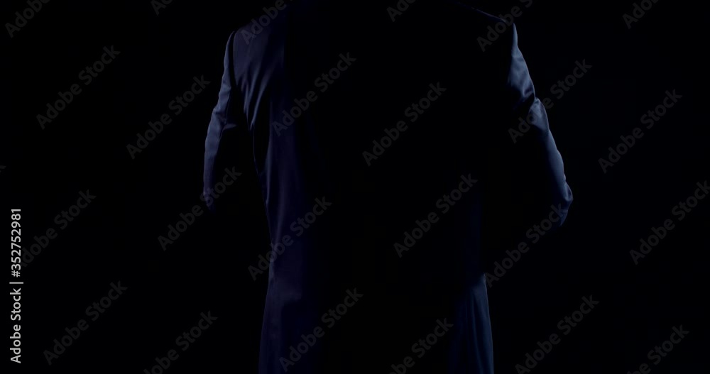 man is gesticulating by hands, dressed business suite, rotating body around himself man is gesticulating by hands, dressed business suite, rotating body around himself