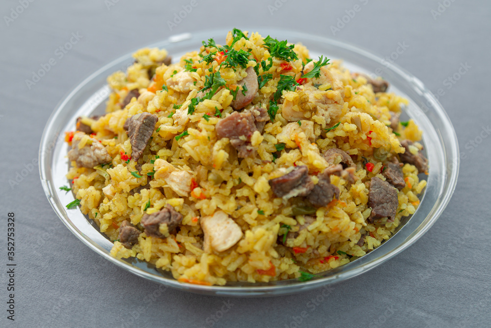 Mixed rice with meat Paella on a clear plate Mixed rice with meat Paella on a clear plate