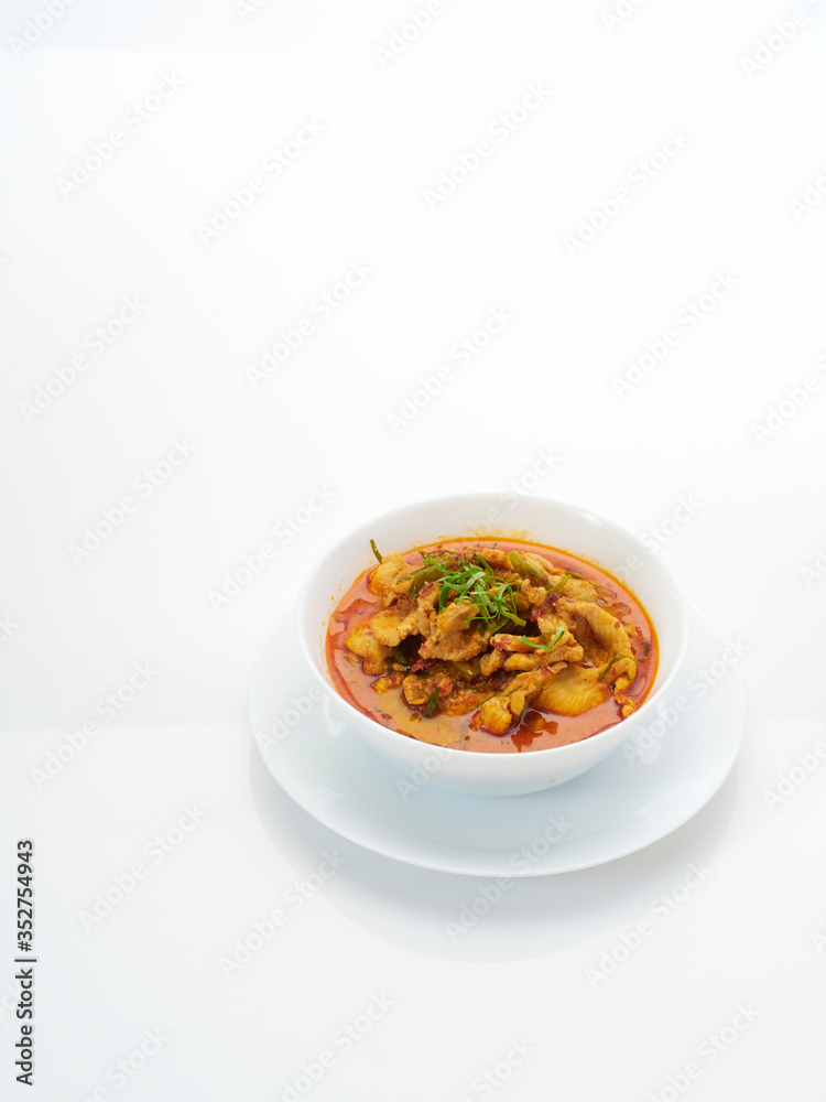 Panang chicken curry in white bowl. Panang chicken curry in white bowl.