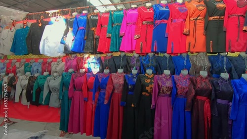 Rows Of Deel On Display. Traditional Women's Clothing For Sale At Naran Tuul Market. Ulaanbaatar, Mongolia. photo