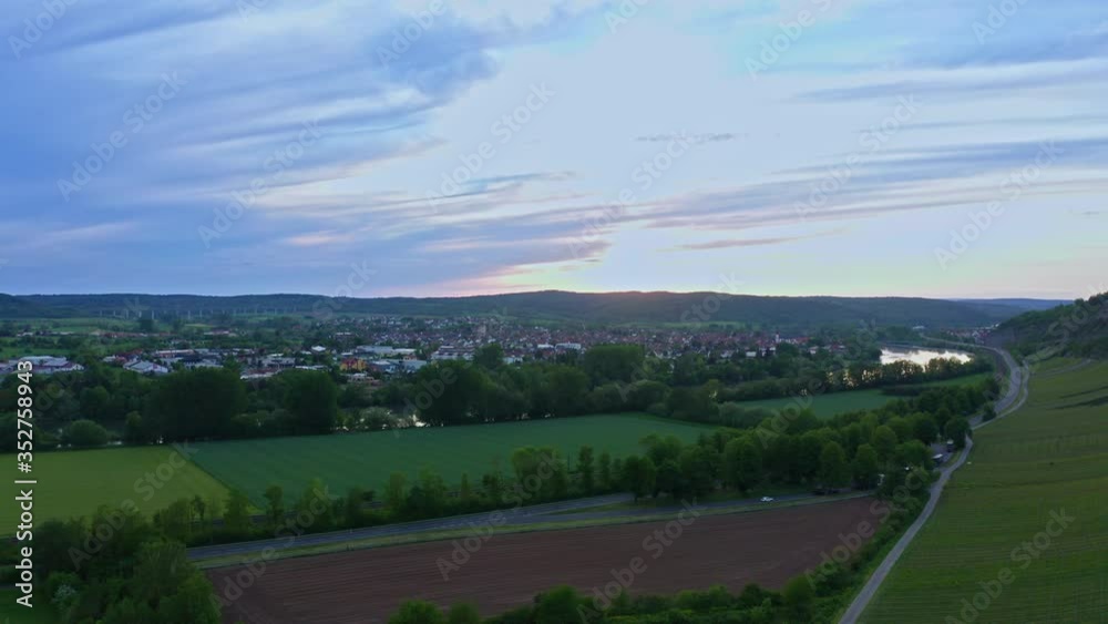 Aerial view of vineyard valley, hills, road and river. Beautiful sunset, romantic sky. Germany. Drone shot. Aerial view of vineyard valley, hills, road and river. Beautiful sunset, romantic sky. Germany. Drone shot.