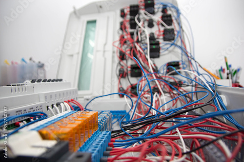 Assembly of the automatic control panel. Information technology. Technology electrotechnical design. Modern engineering, futuristic, science communication concept. Digital technology background