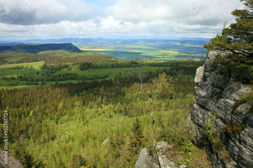 Spring Stolowe Mountain range- landscape near small, picturesque Pasterka village in Poland. Famous tourist attraction. Oldest mountains in Europe. View from Szczeliniec Wielki, Great Szczeliniec. photo