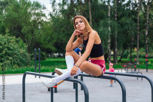 Woman relaxing after a evening workout outdoors