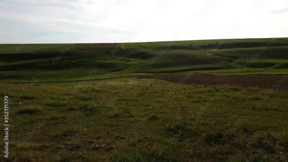 Very beautiful green landscape with hills in summer with sun in a rural place Very beautiful green landscape with hills in summer with sun in a rural place