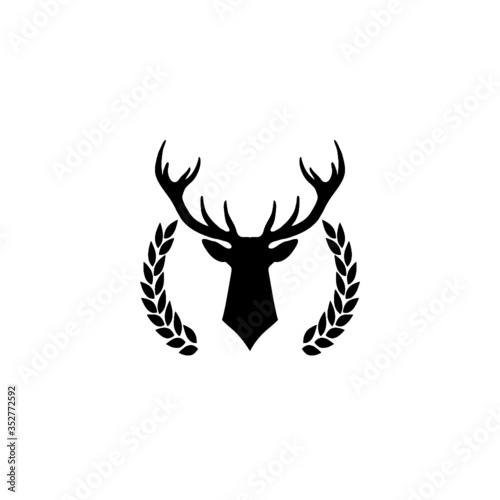 Hunting trophy. Deer head with big antlers in laurel wreath isolated on white background