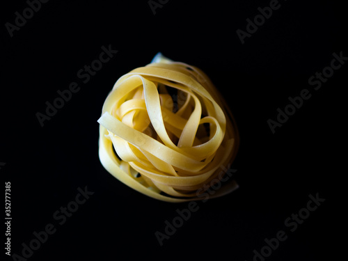 tagliatelle pasta on black food italian