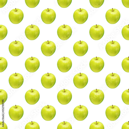 Pattern of green apples on a white background. Isolated fruits. Image for fabric, wallpaper and wrapping paper.